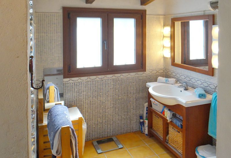 The Ensuite bathroom has a lot of space and a window.