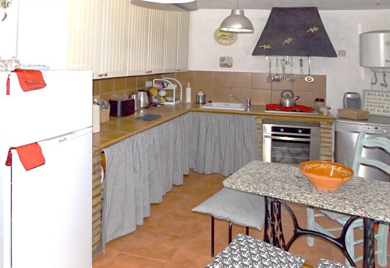 The kitchen is fully equipped and with a dining table