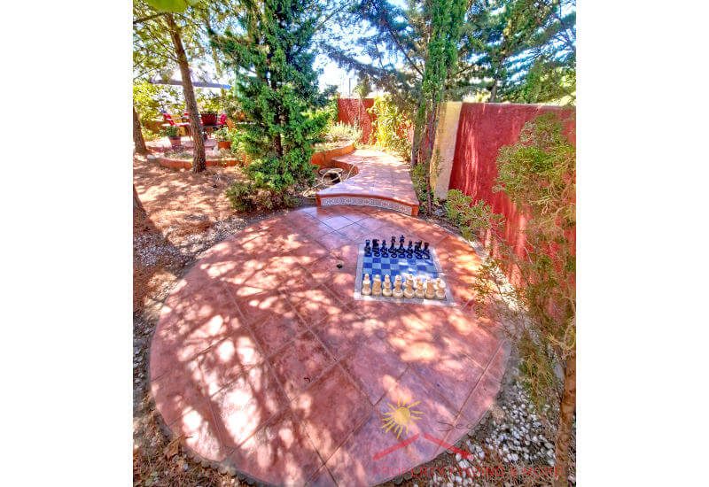 The woodland garden with a chess game on the floor and a wind wall