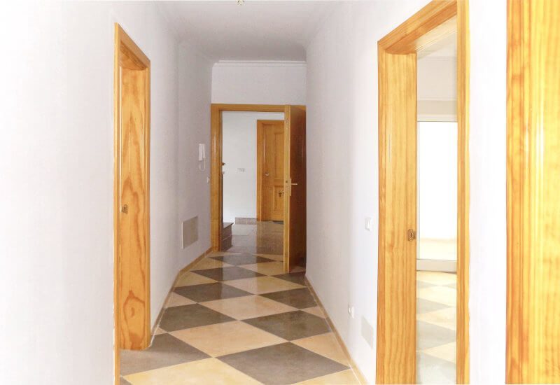 Hallway with doors to all rooms