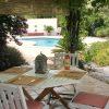 Terrace & pool Table for lunch in the shadow of the wine with pool in the background