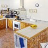 Kitchen Kitchen with gas field and electric oven. Place to eat at the bar