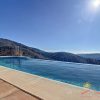 From the modern infinity pool you have a phantastic view over the hills to the sea of the Axarquía