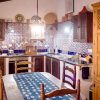 Kitchen Fully equipped kitchen with a table in the middle