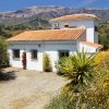 Casa Churrispa front elevation with parking place and view on Marroma