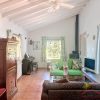 Lounge Living room with sitting area and fireplace, as well as windows and a sloping roof with beams