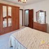 Large master bedroom with large wall unit and plenty of space