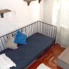 Master bedroom of casa Olivia in Sedella with additional room with bed and window