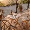 Terrace with chairs and table in the setting warm sun of Spain