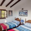 Bedroom B Bedroom B is equipped with two beds and has a sloping roof with beautiful wooden beams