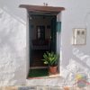 Old entrance door to the village house Casa Afifa