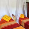 Yellow double guest bedroom The yellow bedroom for guests has two single beds.