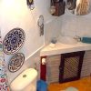 Shower Shower room with corner basin and toilette.