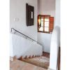 The staircase is wide and has a window The staircase is wide and has a window