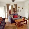 Lounge Lounge with sofas an entrance from the terrace and staircase to the second floor