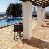 Photo of the terrace and pool area with view on the Axarquia