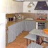 The kitchen is fully equipped and with a dining table