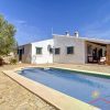Casa Hennie for sale here with terrace and pool in front and the house behind in the sun