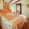 Guest room The guest room has a sloping roof and original wooden beams