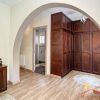 a big wooden wardrobe is integrated the master bedroom