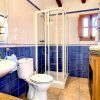Spacious family bathroom with shower and toilet.