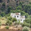 a distant view of Finca Ladera in the Axarquia for sale