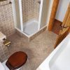 The bathroom is spacious with nice traditional tiles