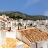 View View over the old village of Sedella with typical andalusian roofs.