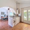 Kitchen & dining area Seating area next to the kitchen and large glass doors leading to the garden