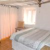 Guest bedroom Guest bedroom with ceiling fan, typical andalusian village window and wardrobes.