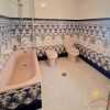 Bathroom A large bathroom with bathtub, toilet, bidet and washbasin