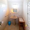 En-suite Bathroom The 2nd bedroom has a small ensuite bathroom with a little window, a basin on one side and a toilette in the middle.