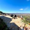 a bit terrace in front of the house with sitting area and a fantastic view over the Axarquía
