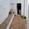 Small patio with gas boiler and door to bathroom